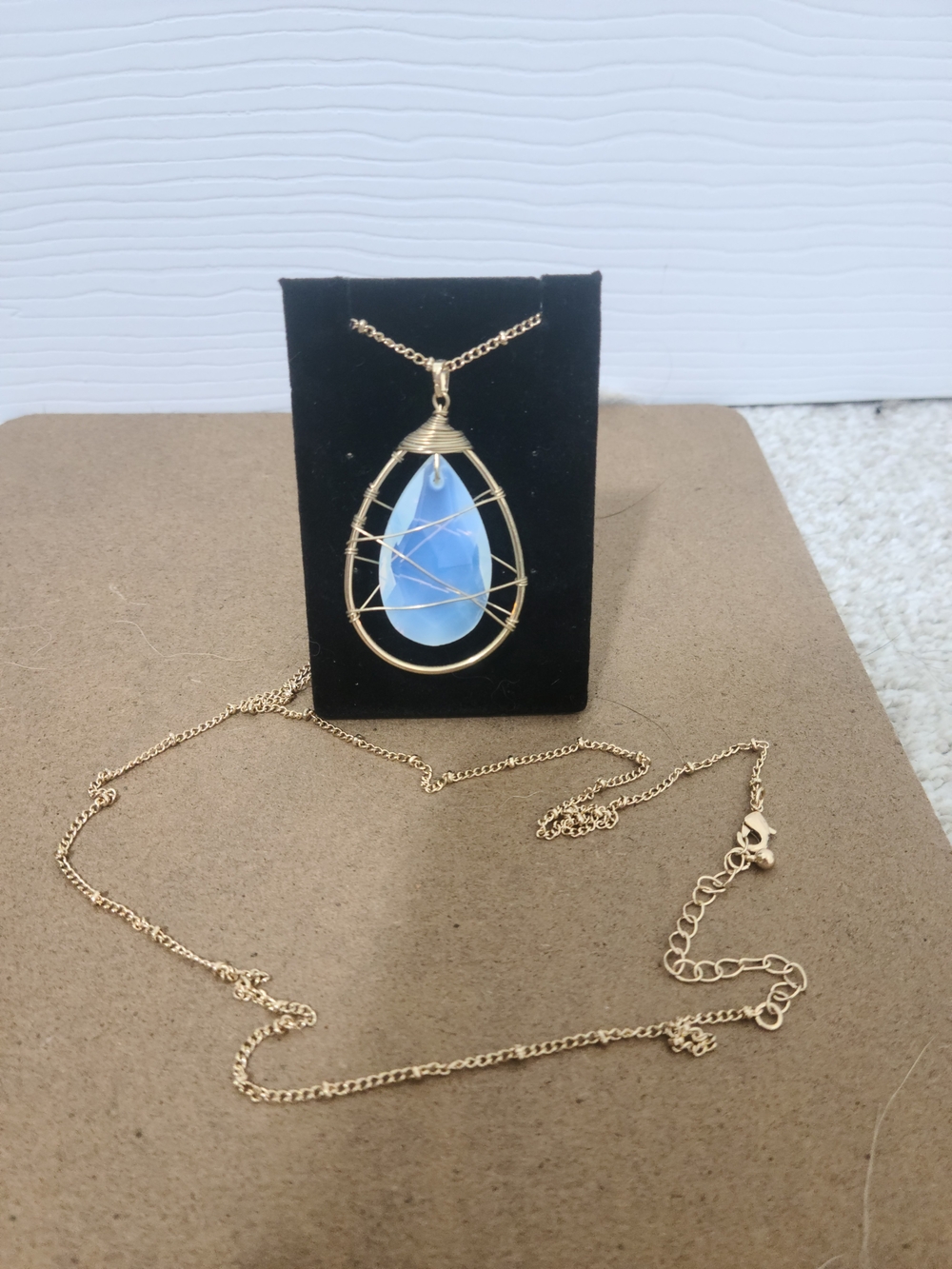 Gold Wire-Wrapped Teardrop Pendant Necklace with Blue Opalescent Stone
